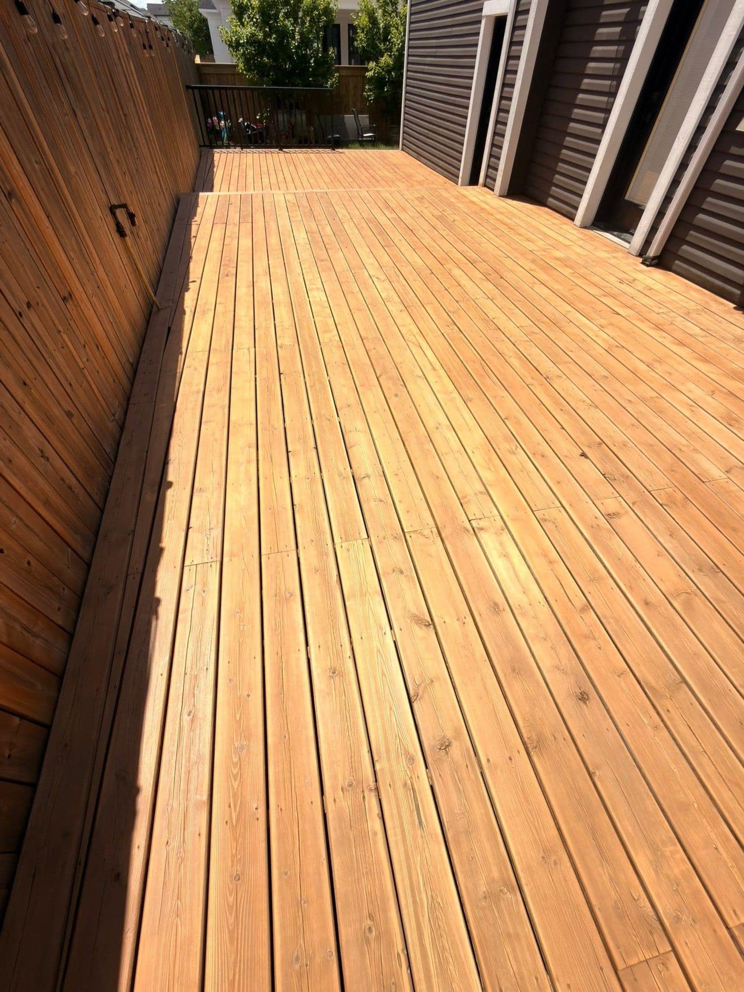 Cedar deck after restoration, freshly sanded and stained